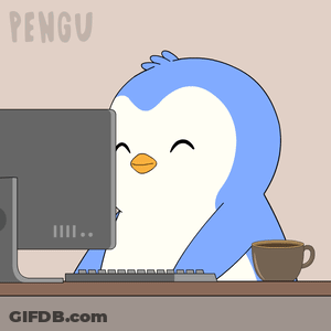 Penguin Sitting In Front Of Computer GIF