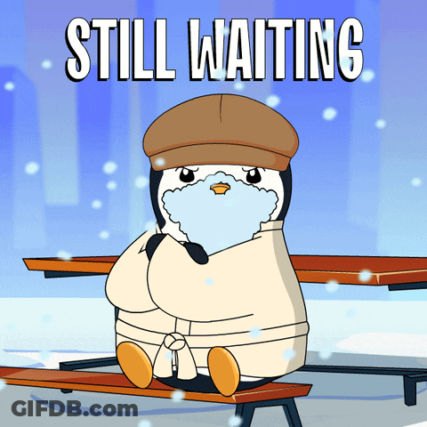 Penguin Sitting On Bench Still Waiting GIF