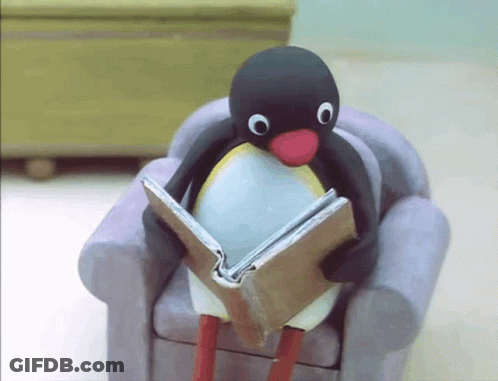 Penguin Sitting On Chair Reading Book GIF