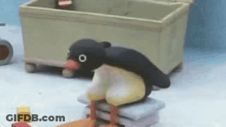 Penguin Sitting On Pillows GIF