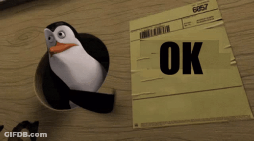 Penguin Standing Next To OK Paper GIF