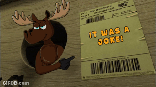 Penguin Sticking Head Through Paper Saying It Was A Joke GIF