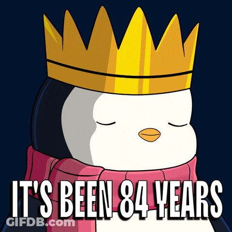 Penguin Wearing Crown And Scarf Saying It's Been 84 Years GIF