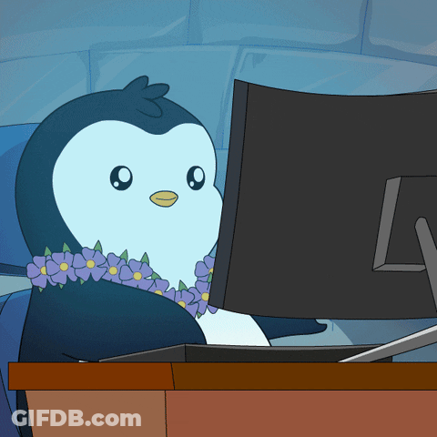 Penguin Wearing Lei Looking At Computer Monitor GIF