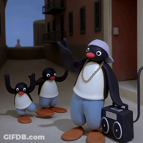 Penguin With Chain Standing Next To Two Penguins And Boombox GIF