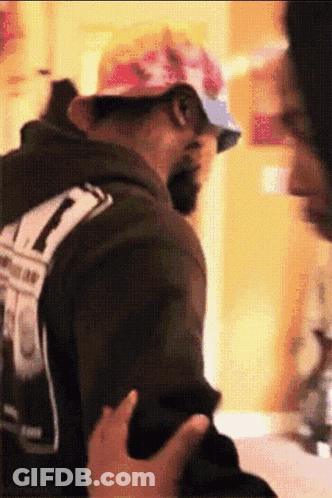 Penguins Standing Together In Outfits GIF
