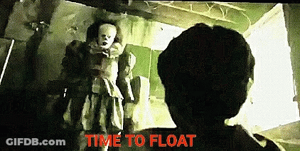 Pennywise The Clown Standing Next To Man In Room GIF