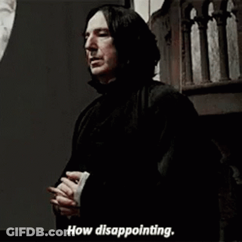 People And Man In Black Cape Around Table With Bottles GIF