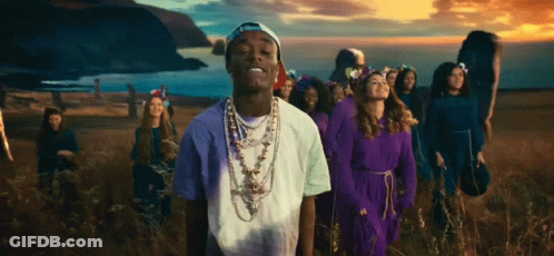 People And Man With Necklace In Field GIF