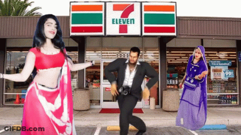 People Are Dancing In Front Of A 7 Eleven GIF