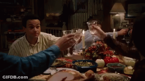 People At Table With Food And Wine GIF