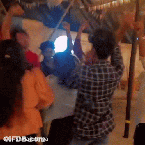 People Dancing Around Table GIF