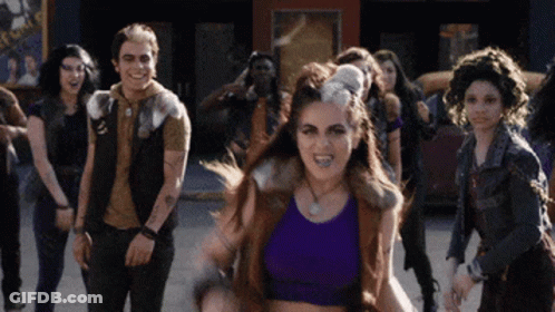People Dancing By E Sign GIF