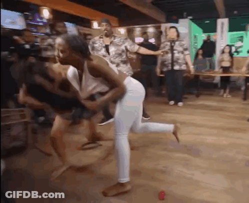 People Dancing In Bar Woman Holding Butt GIF
