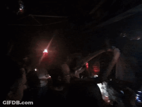 People Dancing In Dark Room With Disco Ball GIF