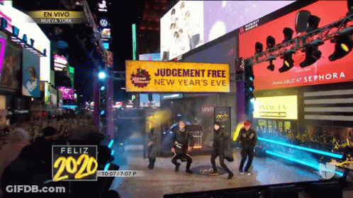 People Dancing In Front Of Judgement Free Sign GIF