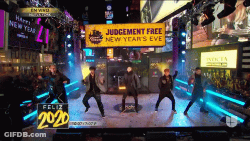 People Dancing In Front Of Judgement Free Sign GIF