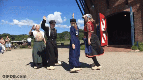 People Dancing In Front Of Red Door Z GIF