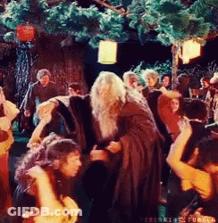 People Dancing In Front Of Tree In Forest GIF