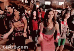 People Dancing In Room Woman In Red Dress GIF