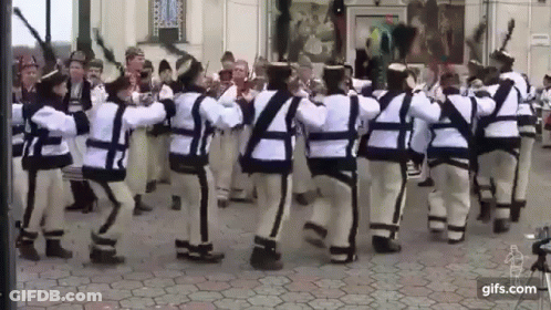 People Dancing In Traditional Costumes GIF