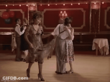 People Dancing On Dance Floor In Red Room GIF