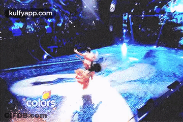 People Dancing On Stage In Front Of Crowd Colors GIF