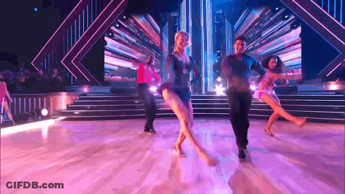 People Dancing On Stage Purple Background GIF