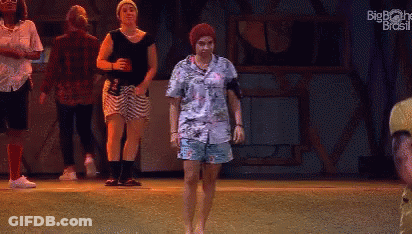 People Dancing On Stage With Big Brother Brasil Logo GIF