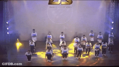 People Dancing On Stage With Dance Company Logo GIF