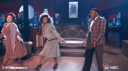 People Dancing On Stage With NBC Logo GIF
