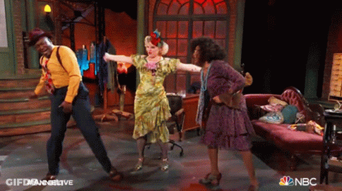 People Dancing On Stage With NBC Logo GIF