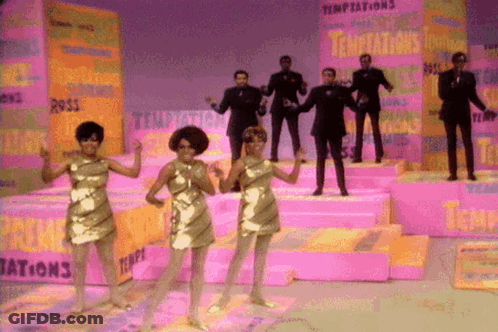 People Dancing On Stage With Temptations Behind GIF