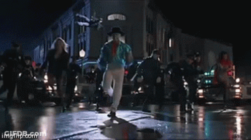 People Dancing On Wet Street Saying Imgflip.com GIF