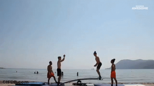 People Doing Trick On Seesaw At Beach Awesome GIF