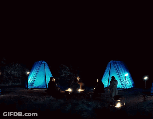 People Gathering Around Campfire GIF