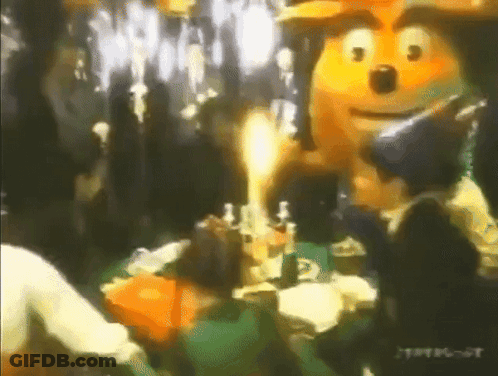 People Gathering Around Cartoon Character In Party Hat GIF