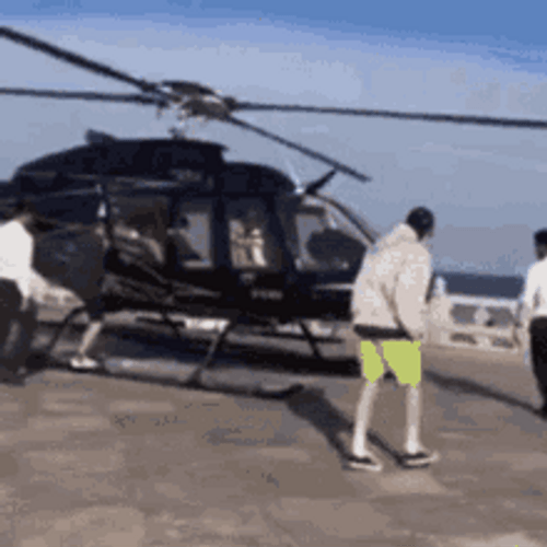 People Getting In Helicopter Ready For Take Off GIF