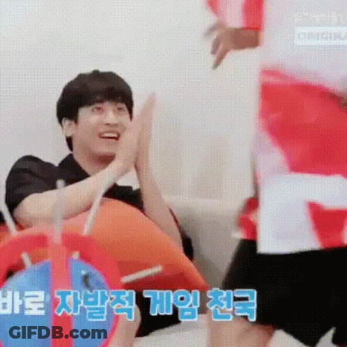 People High Fiving On Couch GIF
