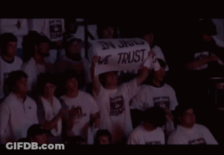 People Holding Sign In Jang We Trust GIF