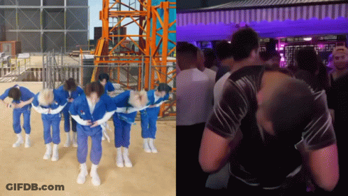 People In Blue Jumpsuits Dancing In Front Of Crane GIF