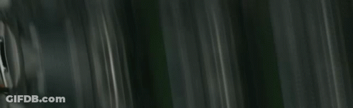 People In Bunny Masks By Cars And Building GIF