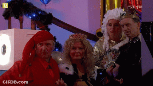 People In Costumes In Front Of TV Screen Saying TVP 1 KC GIF