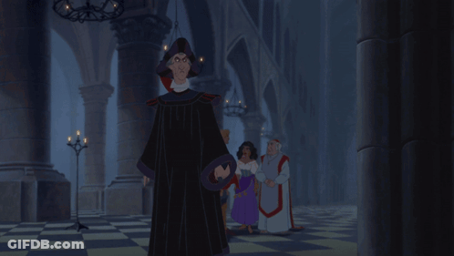 People In Dark Room With Man In Black Robe GIF