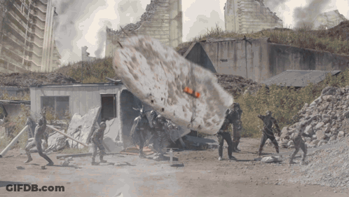 People In Front Of Building With Huge Explosion GIF