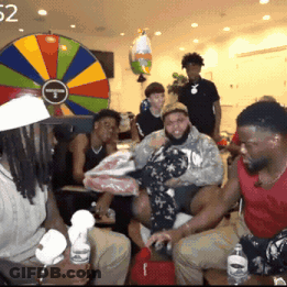 People In Front Of Colorful Spinning Wheel 52 GIF