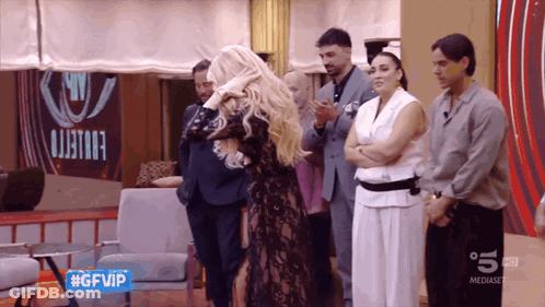 People In Front Of GFVIP Sign GIF