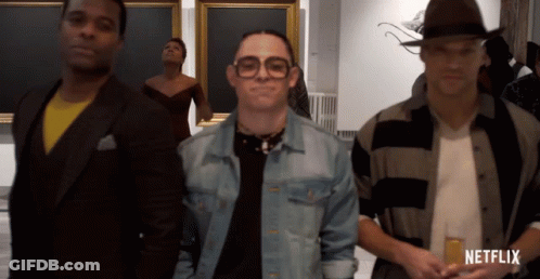 People In Front Of Netflix Sign GIF