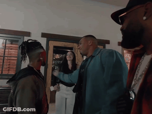 People In Front Of Rider Sign GIF