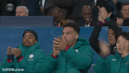 People In Green Jackets With Qatar GIF